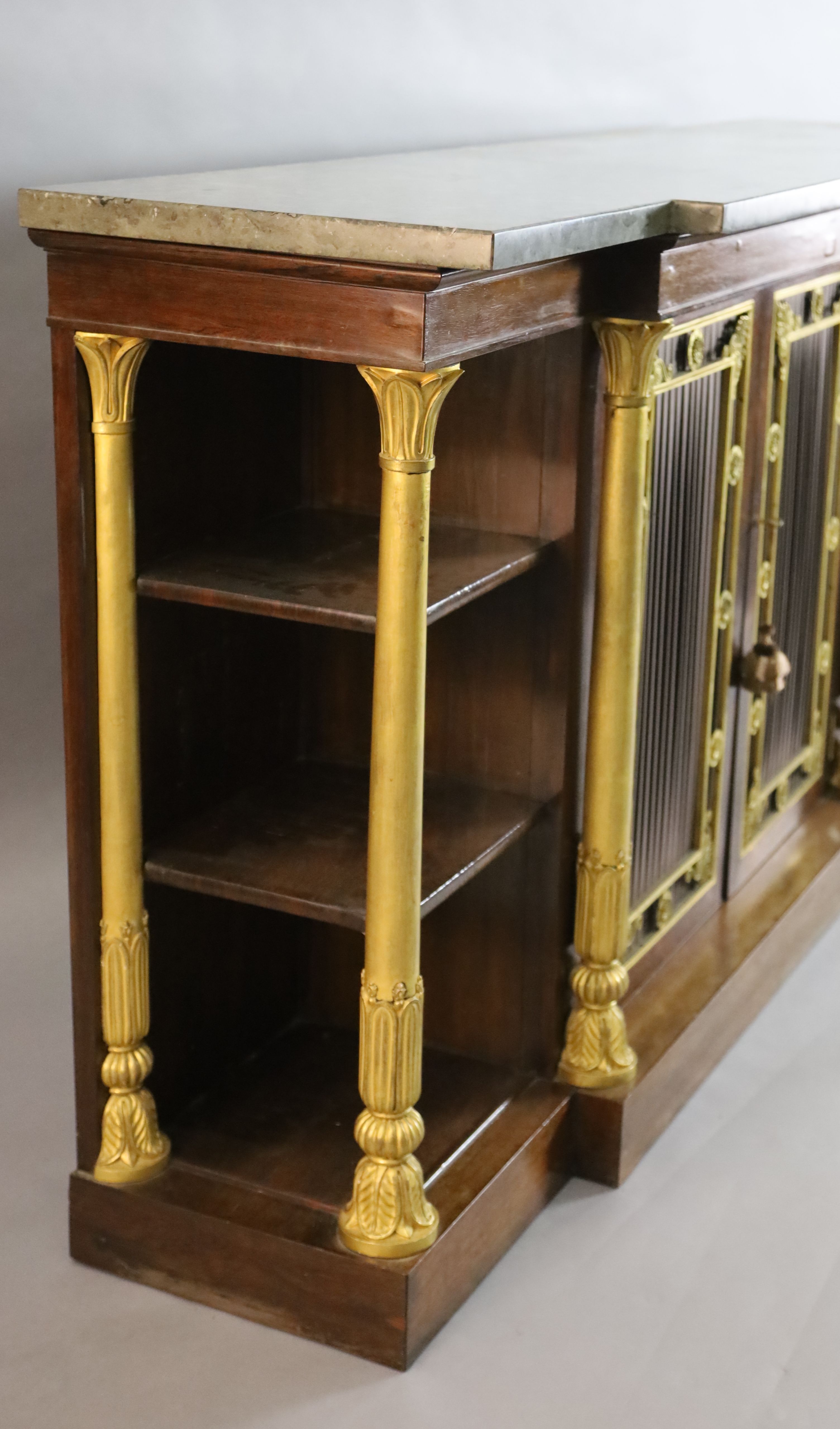 A Regency ormolu mounted rosewood breakfront side cabinet, W.5ft 9in. D.1ft 6in. H.3ft 2in.